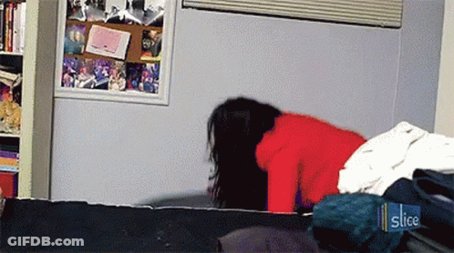 Woman In Red Sweater Laying On Bed With Slice Sticker GIF