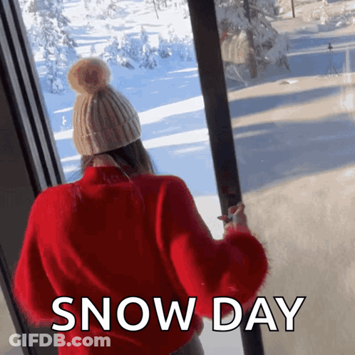 Woman In Red Sweater Looking Out Snow Day GIF