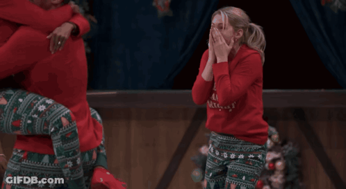 Woman In Red Sweater Saying Merry Christmas GIF
