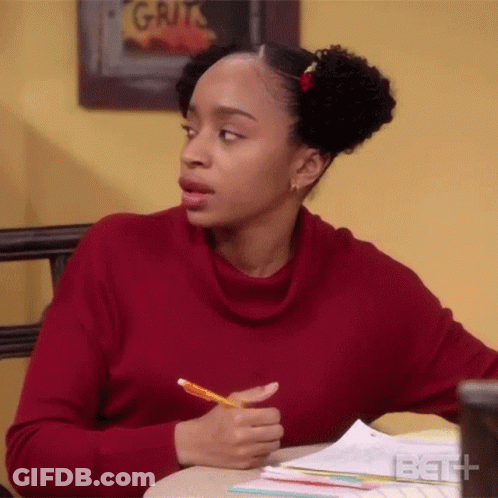 Woman In Red Sweater Sitting At Desk With Pencil GIF