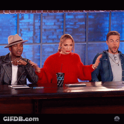Woman In Red Sweater Sitting With Two Men GIF