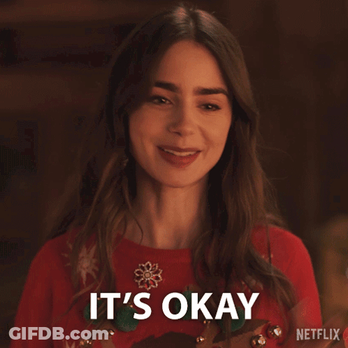 Woman In Red Sweater Smiling Saying It's Okay GIF