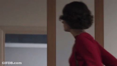 Woman In Red Sweater Standing GIF