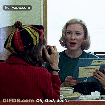 Woman In Red Sweater Talking On Cell Phone GIF