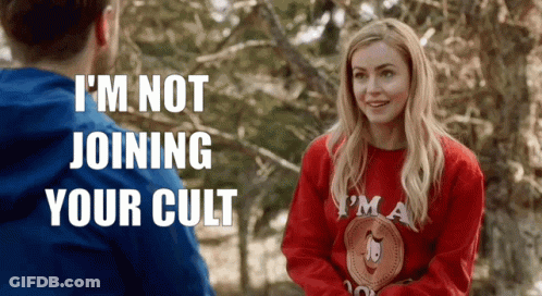 Woman In Red Sweater Talking To Man In Blue GIF