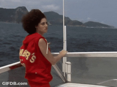 Woman In Red Sweater With Amber's On Boat GIF