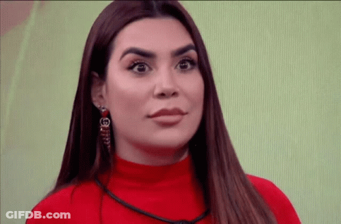Woman In Red Sweater With G Earring GIF