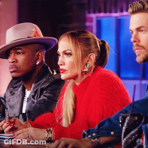 Woman In Red Sweater With Two Men In Hats GIF