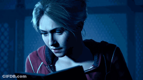 Woman In Red Sweatshirt Reading Book GIF