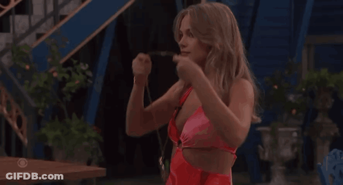 Woman In Red Swimsuit In Front Of CBS Sign GIF