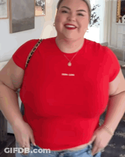 Woman In Red T-Shirt And Jeans Smiling GIF