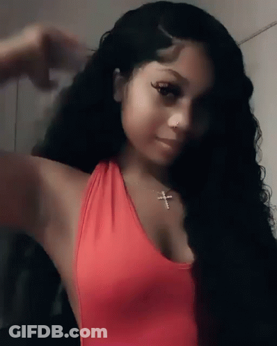 Woman In Red Tank Top And Cross Necklace Taking Selfie GIF