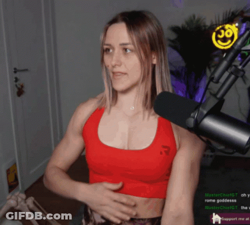 Woman In Red Tank Top At Microphone With Smiley Face GIF