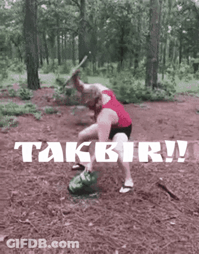 Woman In Red Tank Top Standing In Woods With Takbir GIF