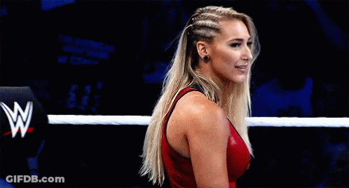 Woman In Red Tank Top Standing In Wrestling Ring GIF