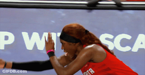 Woman In Red Tank Top Stretching In Front Of PWT SCA Sign GIF