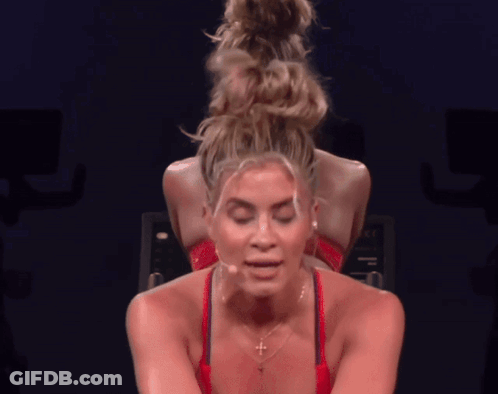 Woman In Red Tank Top With Cross GIF
