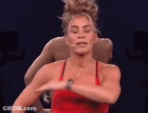 Woman In Red Tank Top With Cross Necklace Dancing GIF
