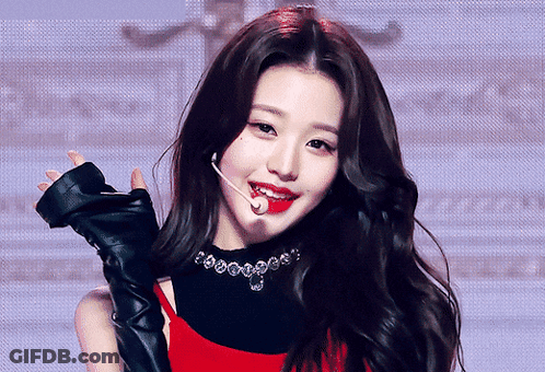 Woman In Red Top And Black Gloves Holding Microphone GIF