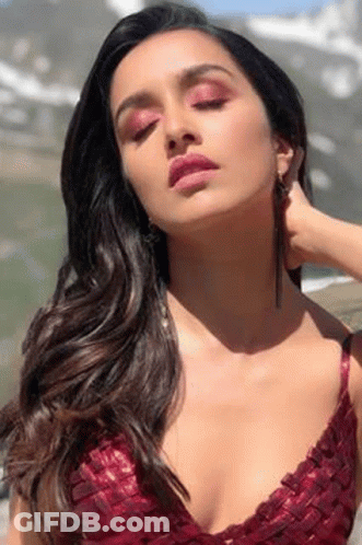 Woman In Red Top And Earrings GIF