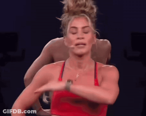 Woman In Red Top Dancing In Front Of Man GIF