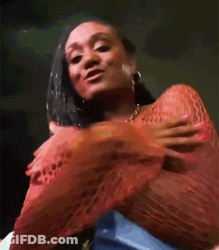 Woman In Red Top Holding Breast GIF
