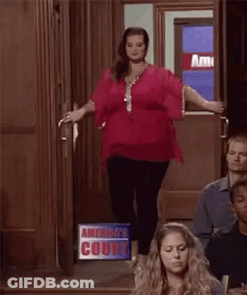 Woman In Red Top In Courtroom GIF