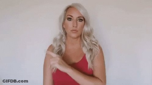 Woman In Red Top Pointing Up All Of That GIF