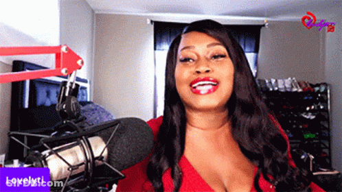 Woman In Red Top Smiling At Microphone Lovelyti GIF