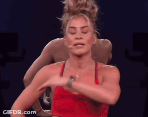 Woman In Red Top With Cross Necklace GIF
