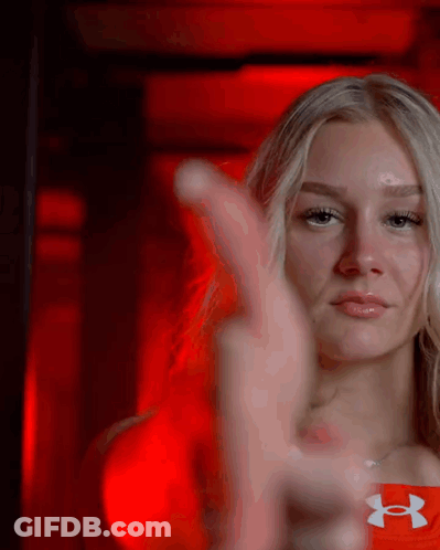 Woman In Red Under Armour Shirt Thumbs Up GIF