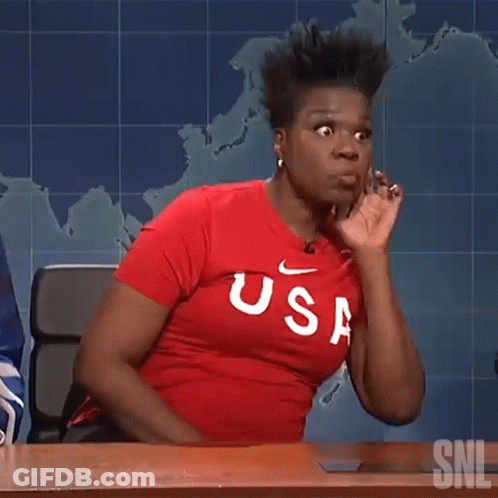 Woman In Red USA Shirt Sitting At Desk GIF