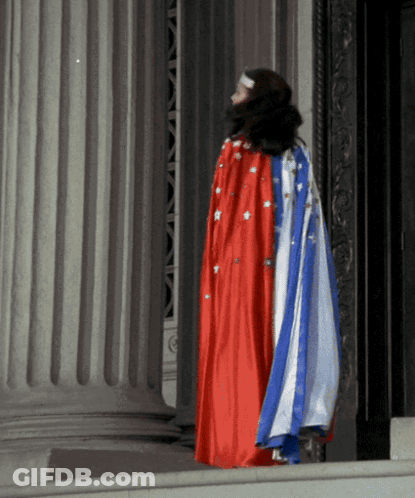Woman In Red White And Blue Cape GIF
