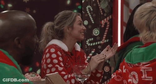 Woman In Red-White Polka Dot Sweater With Wine GIF