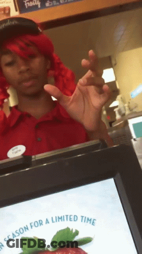 Woman In Red Wig Standing In Front Of Screen Saying Season For A Limited Time GIF