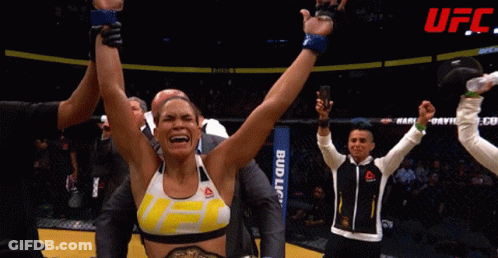 Woman In Reebok Tank Top With Arms Up GIF