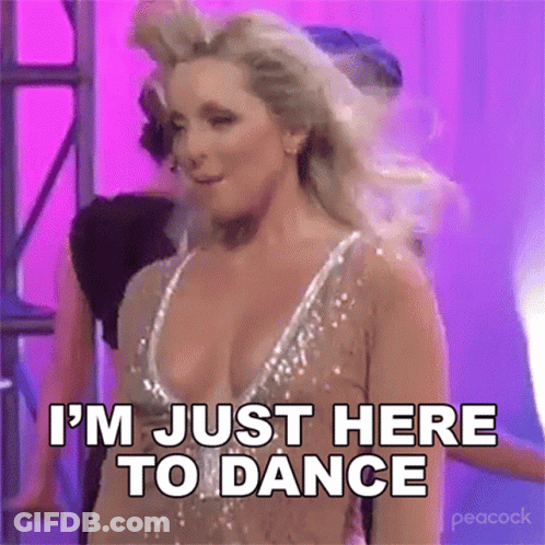 Woman In Revealing Dress Dancing Says I'm Just Here To Dance GIF