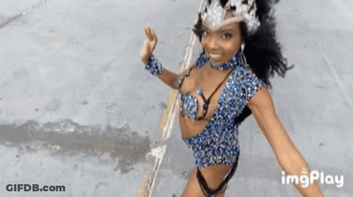 Woman In Revealing Outfit Dancing In Parade GIF