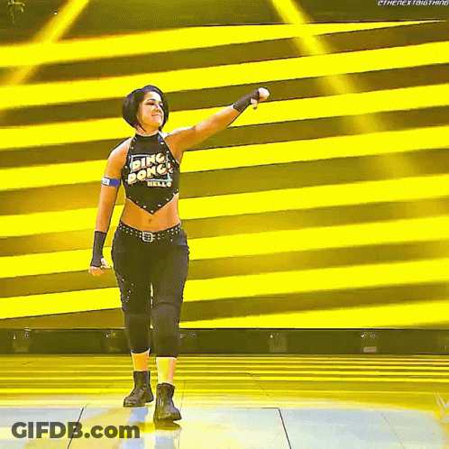 Woman In Ring Of Honor Shirt Holding Microphone On Stage GIF