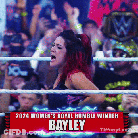 Woman In Ring With 2024 Women's Royal Rumble Winner Bayley Sign GIF