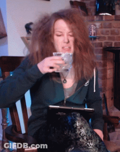 Woman In Rocking Chair Holding Glass GIF