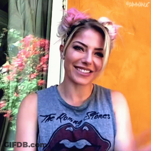 Woman In Rolling Stones T-Shirt Smiling GIF