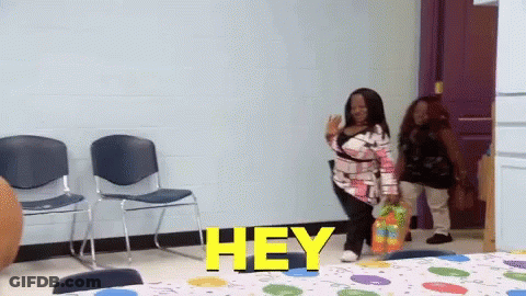 Woman In Room With Hey On Wall GIF