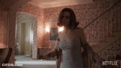 Woman In Room With Netflix Logo GIF