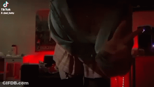 Woman In Room With Red Lights GIF