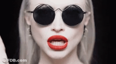 Woman In Round Sunglasses Making Funny Face GIF