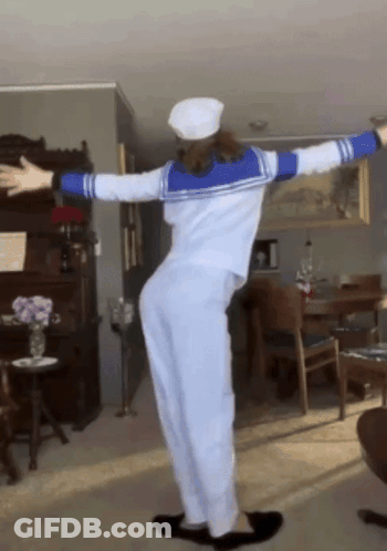 Woman In Sailor Costume With Arms Outstretched GIF