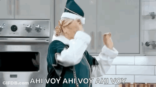 Woman In Santa Costume Dancing With Hands Up GIF