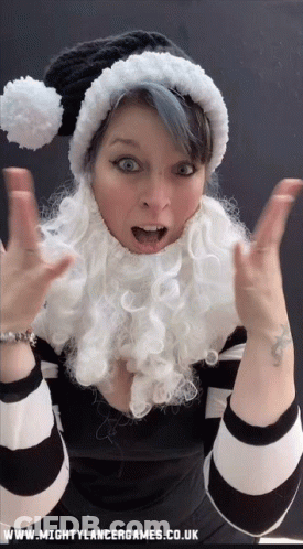 Woman In Santa Hat And Beard With Www.mightylancergames.co.uk GIF