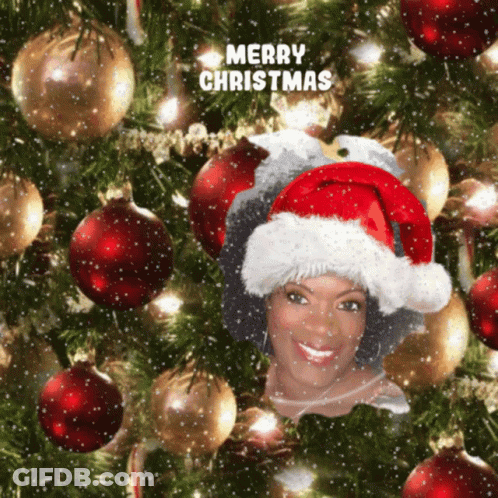 Woman In Santa Hat Saying Merry Christmas GIF